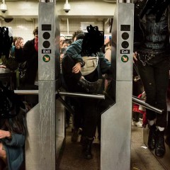 Three people duck under or jump over subway turnstiles. Their faces are blacked out.